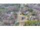 A high aerial view shows the large lot, with house and outbuildings bordered in yellow at 2111 Jade Dr, Canton, GA 30115