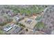 Aerial perspective of the lot with older house and outbuildings, bordered in yellow at 2111 Jade Dr, Canton, GA 30115