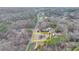 Wide angle aerial view of the lot with older house and outbuildings outlined in yellow at 2111 Jade Dr, Canton, GA 30115