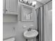 Bathroom with a white sink, vanity, shower with curtain and tiled walls at 2111 Jade Dr, Canton, GA 30115