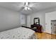 Bedroom featuring hardwood floors, dresser with mirror, and a window with shutters at 2111 Jade Dr, Canton, GA 30115