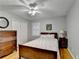 Bedroom with ceiling fan, wooden furniture, hardwood floors, and a closet for storage at 2111 Jade Dr, Canton, GA 30115