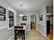 Cozy dining area featuring modern light fixture, window and view to adjacent room at 2111 Jade Dr, Canton, GA 30115