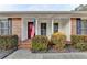 Inviting front porch with brick accents and well-kept shrubbery offering a warm welcome to the home at 2111 Jade Dr, Canton, GA 30115