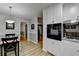 Open-concept kitchen and dining area with matching countertops and stainless steel appliances at 2111 Jade Dr, Canton, GA 30115