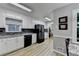 A well-lit kitchen featuring stainless steel appliances, countertops, and gray walls at 2111 Jade Dr, Canton, GA 30115