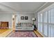 Living room with hardwood floors, area rug, shutters, and traditional furnishings at 2111 Jade Dr, Canton, GA 30115