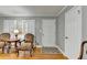 Cozy living room featuring hardwood floors, shuttered windows, and comfortable seating for relaxation at 2111 Jade Dr, Canton, GA 30115