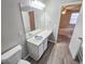 Neutral bathroom featuring a single sink vanity and a view into the spacious bedroom area at 3160 Sable Trl, Atlanta, GA 30349