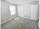 Bedroom with neutral walls and carpet and a large closet at 3160 Sable Trl, Atlanta, GA 30349