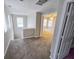 Upstairs hallway features neutral paint and carpet with an open view to the main bedroom at 3160 Sable Trl, Atlanta, GA 30349