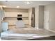 Open kitchen with white cabinets, stainless steel appliances, and a center island at 3160 Sable Trl, Atlanta, GA 30349