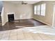 Spacious living room featuring wood flooring, a fireplace, and lots of natural light at 3160 Sable Trl, Atlanta, GA 30349