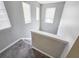 Carpeted staircase with neutral walls and natural light from several windows at 3160 Sable Trl, Atlanta, GA 30349