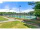 Fenced community tennis courts with lights for nighttime play at 3160 Sable Trl, Atlanta, GA 30349