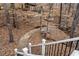 Picturesque backyard featuring a stone pathway surrounded by lush greenery and trees at 10635 N Edgewater Pl, Johns Creek, GA 30097
