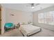 Bright bedroom with ceiling fan, ample natural light, and a comfortable bed at 10635 N Edgewater Pl, Johns Creek, GA 30097