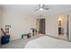 Bedroom with ceiling fan and a view into an ensuite bathroom at 10635 N Edgewater Pl, Johns Creek, GA 30097