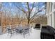 Spacious outdoor deck furnished with a dining table and plush seating offering scenic backyard views and relaxation at 10635 N Edgewater Pl, Johns Creek, GA 30097
