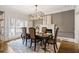 Dining room with elegant lighting, a fireplace, and neutral decor at 10635 N Edgewater Pl, Johns Creek, GA 30097