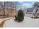 Long driveway leads to a three-car garage of this charming, light brick home at 10635 N Edgewater Pl, Johns Creek, GA 30097