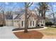 Charming two-story home with a brick exterior, lush landscaping, and an attached two-car garage at 10635 N Edgewater Pl, Johns Creek, GA 30097