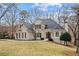 Charming two-story home featuring a well-manicured lawn and an inviting entrance at 10635 N Edgewater Pl, Johns Creek, GA 30097