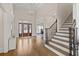 Spacious foyer with hardwood floors, staircase and ample natural light at 10635 N Edgewater Pl, Johns Creek, GA 30097