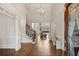 Grand foyer with high ceilings, hardwood floors, and a beautiful chandelier at 10635 N Edgewater Pl, Johns Creek, GA 30097