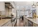 Well-appointed kitchen with a large island, stainless appliances and an adjacent breakfast nook at 10635 N Edgewater Pl, Johns Creek, GA 30097