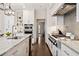 Gourmet kitchen featuring professional-grade appliances, custom cabinetry, and sleek countertops at 10635 N Edgewater Pl, Johns Creek, GA 30097