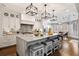 Bright kitchen featuring a large island, modern appliances, and hardwood floors at 10635 N Edgewater Pl, Johns Creek, GA 30097