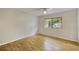Bedroom with a ceiling fan and wood floors, features a large window at 3817 Paces Ferry West, Atlanta, GA 30339