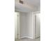 Neutral hallway featuring two white doors with a vent above at 3817 Paces Ferry West, Atlanta, GA 30339
