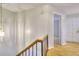 Upstairs hallway with railing and light fixture at 3817 Paces Ferry West, Atlanta, GA 30339