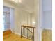 Upstairs hallway with railing and light fixture, leading to stairs at 3817 Paces Ferry West, Atlanta, GA 30339
