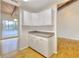 Corner kitchen nook with ample white cabinetry, countertops, and windows, offering functionality and natural light at 3817 Paces Ferry West, Atlanta, GA 30339