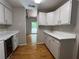 Kitchen with bright countertops, hardwood flooring, and wine cooler at 3817 Paces Ferry West, Atlanta, GA 30339