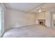 Bright living room featuring ceiling fan, brick fireplace, and neutral carpeting at 3817 Paces Ferry West, Atlanta, GA 30339