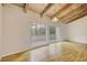 Inviting living room with hardwood floors, large windows and doors leading to a balcony, offering natural light and outdoor access at 3817 Paces Ferry West, Atlanta, GA 30339