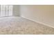 Large living room with light neutral carpet and sliding glass door at 3817 Paces Ferry West, Atlanta, GA 30339