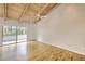 Open living room featuring hardwood floors and large sliding glass doors to a balcony, offering scenic views and natural light at 3817 Paces Ferry West, Atlanta, GA 30339