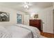 Bright bedroom with hardwood floors and a cozy quilt at 1039 Northcliffe Nw Dr, Atlanta, GA 30318