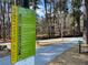 Sign displaying park rules in a wooded area, ensuring a safe and enjoyable environment at 1039 Northcliffe Nw Dr, Atlanta, GA 30318