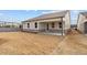 Backyard showcasing a cozy covered patio and newly installed sod at 1723 Juniper Berry Way, Loganville, GA 30052
