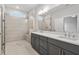 Bathroom with double vanity, a tiled walk-in shower with glass door at 1723 Juniper Berry Way, Loganville, GA 30052