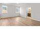 Bedroom with neutral walls, wood-look floors, and plenty of natural light at 1723 Juniper Berry Way, Loganville, GA 30052