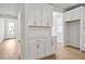 Stylish kitchen features white cabinets, subway tile backsplash, quartz countertops, and stainless steel appliances at 1723 Juniper Berry Way, Loganville, GA 30052
