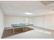 Finished basement with a ping pong table, neutral carpeting, and recessed lighting, providing a versatile space at 2999 Happy Hollow Dr, Conyers, GA 30094