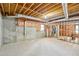 Unfinished basement area with exposed ductwork, concrete floor, and potential for customization at 2999 Happy Hollow Dr, Conyers, GA 30094